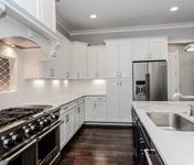 White cabinets & stainless steel appliances in Brookhaven home built by Waterford Homes